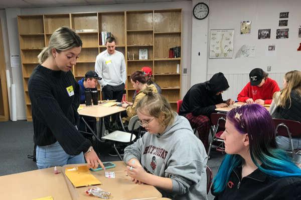 Students assist in a primary school setting